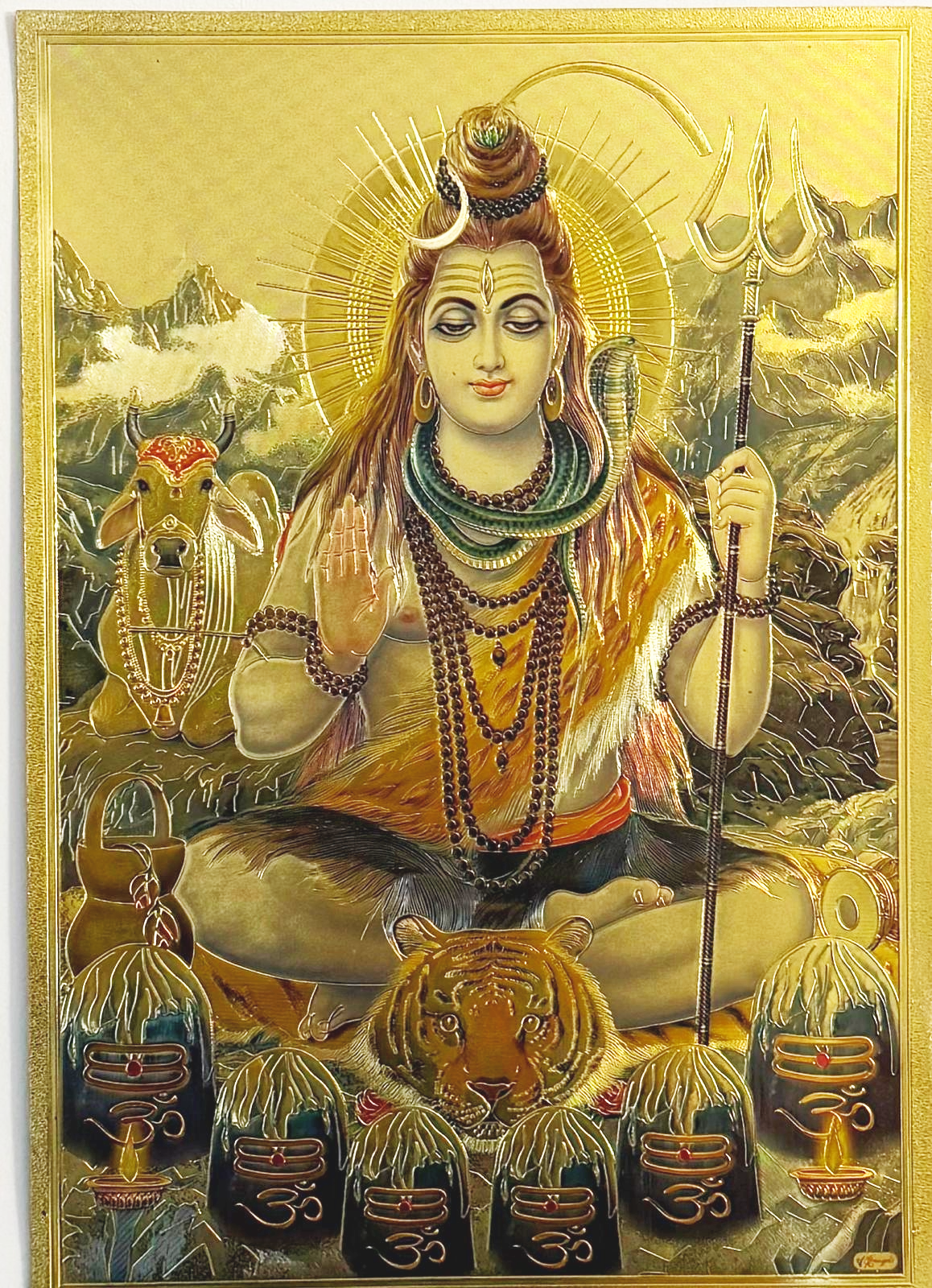 lord shiva in meditative state with abhaya hastam and with 6 shivlings in-front seated on tiger skin and with nandi beside printed on golden fibre sheet (12 * 9 inches)