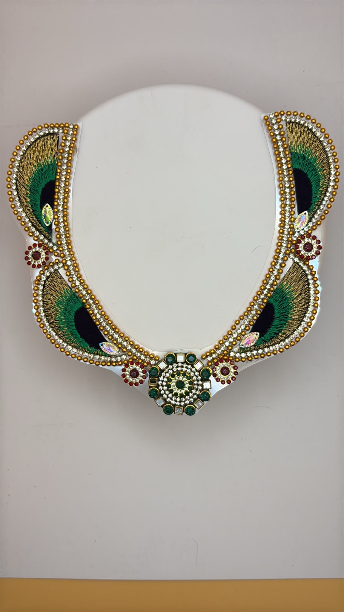 Mala for divine photo frames or idols with peacock feather design